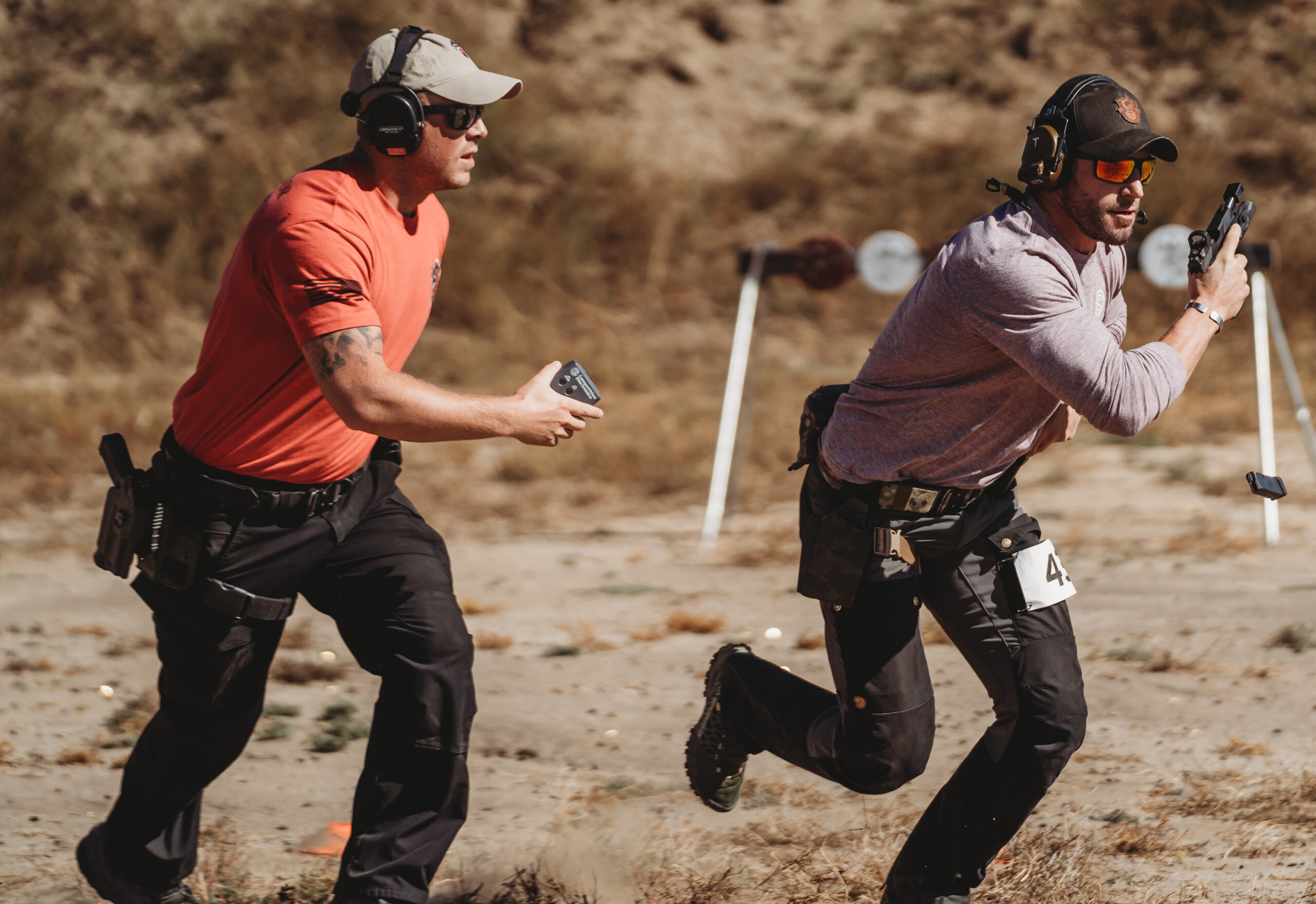 COMMUNITY PARTNERS 2 people running on a course